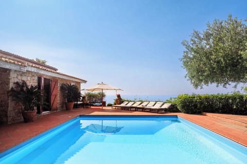 The entrance to the house seen from across the pool.