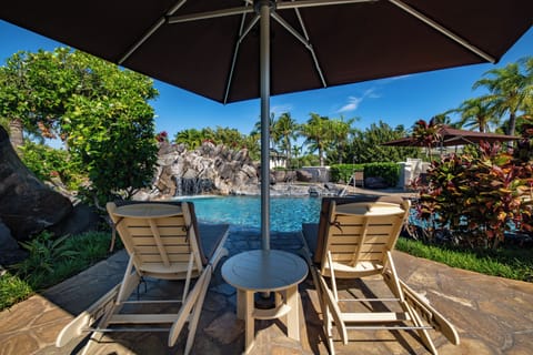 Shaded lounge area at the property pool