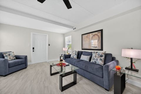 Bright living room w/ comfy seating, clean lines, and a relaxed setup for unwinding after a full day.