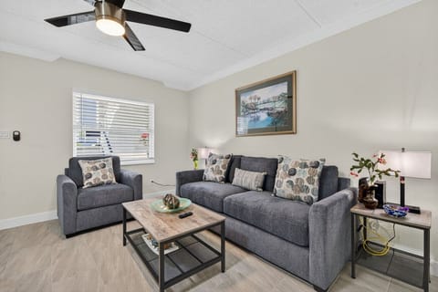 Inviting living room w/ plush seating, warm decor & a relaxed setup perfect for unwinding after a full day.