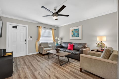 Bright living room w/ comfy seating, warm accents & an open layout perfect for relaxing together.