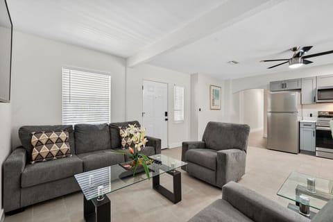 Cozy living room w/ plush seating & soft light for easy lounging.