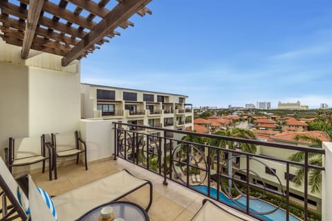 Soak up the sun and the incredible view from your exclusive, furnished balcony. Complete with comfy loungers and a beautiful pergola for that extra touch of shade and style. This is where your vacation memories are made.