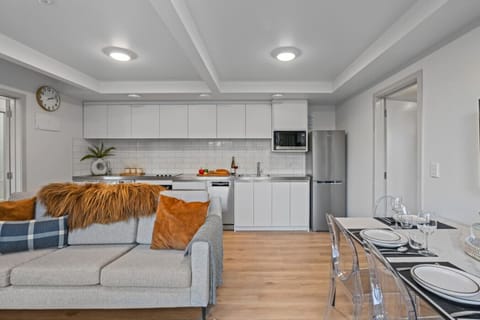 Modern apartment featuring a stylish kitchen, comfortable living area, and elegant décor