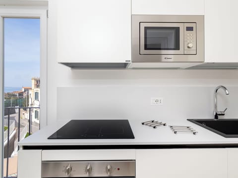 Exclusive Apartment, Partial Sea View | Private kitchen | Fridge, oven, stovetop, espresso maker