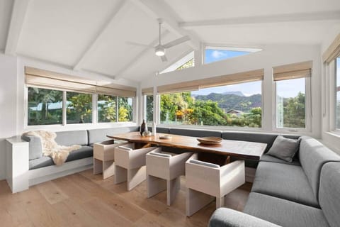 The extra-large dining table serves as the central gathering point of the acommodate 