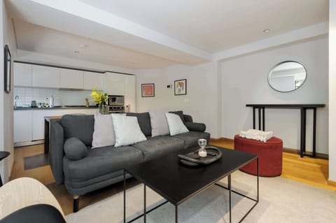 Cozy living room with comfortable seating and natural light.