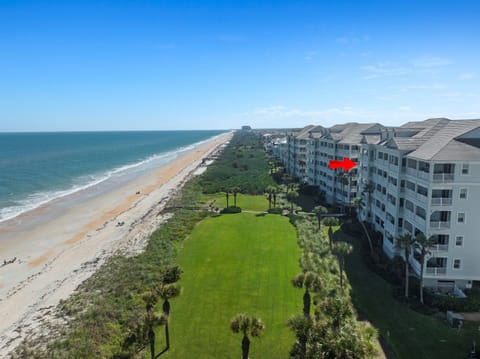 Stunning aerial view showcasing the condo’s prime beachfront location.