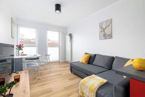 Relax in the stylish living room with a comfortable sofa and modern decor.