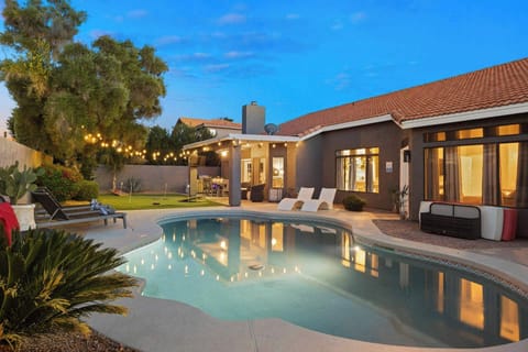 Private backyard oasis with pool & lounge space.