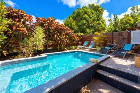 A modernly designed private pool surrounded by a lush tropical garden for a truly private stay in Le Diamant.