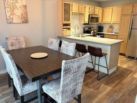 Gather around the spacious dining table and enjoy food or fun. 