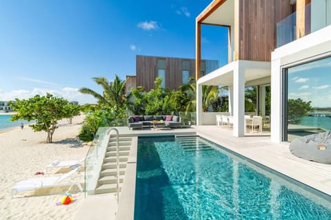 Soak up beachfront luxury with a sparkling pool at hand.