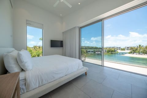 Wake up to sweeping lagoon views from crisp white bedding.