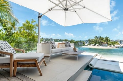 Lounge under the umbrella, steps from your private plunge pool.