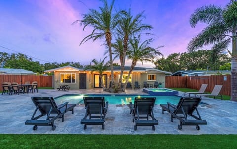 Enjoy some time in this gorgeous backyard where you can swim, relax, or watch a beautiful Florida sunset!