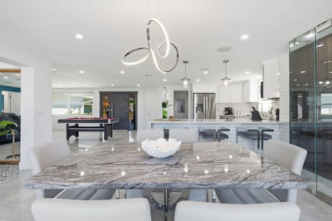 Flow seamlessly from the kitchen to the living room to the dining area. This home is all about togetherness, comfort, and effortless vacation energy — without the cramped corners.