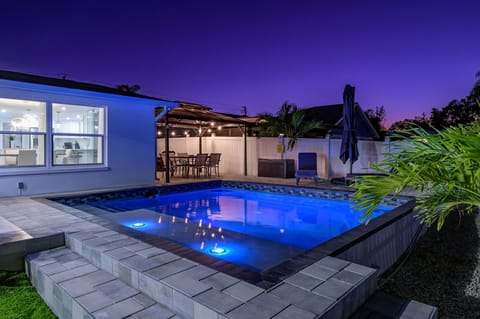 [Backyard] Heated pool, dining area & firepit.