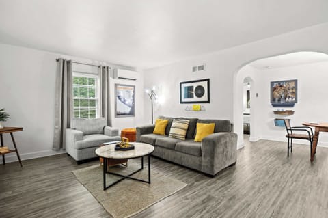 Living Room: Get comfortable and relax on our plush sofa, surrounded by stylish decor that creates a homey atmosphere in the room.