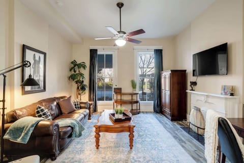 Living Room: Bright living room filled with natural light and comfortable seating.