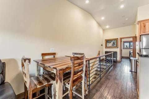 Gather around your rustic dining table where the rich wood grain sets the stage for memorable meals together.