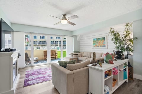 Ample seating in the vibrant living space, perfect for movie nights.