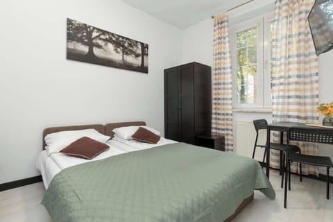 The elegant living area featuring two single beds.