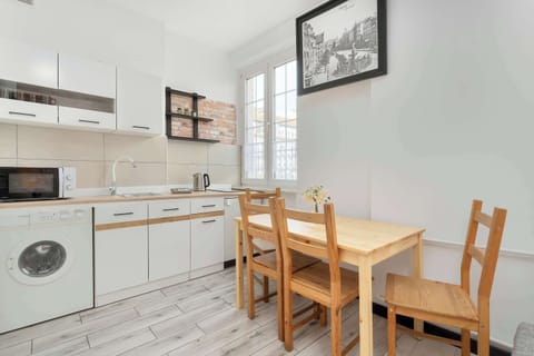The sleek design of the kitchenette blending seamlessly with the living area.