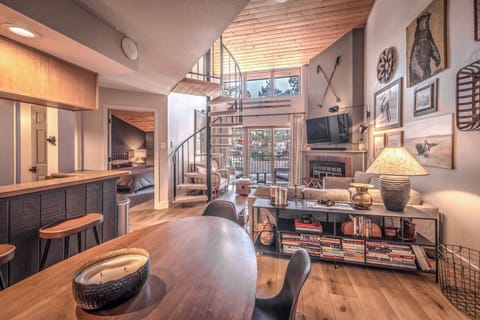Inviting open living area with high ceilings and warm wood tones.