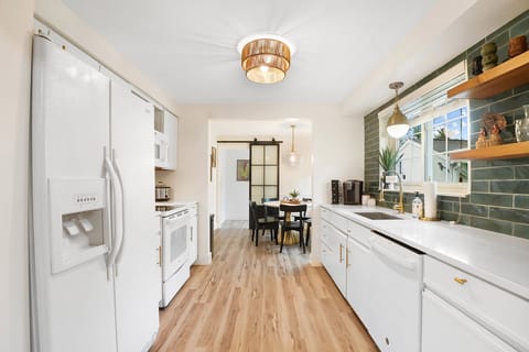 Fully-equipped kitchen includes microwave, dishwasher and garbage disposal.