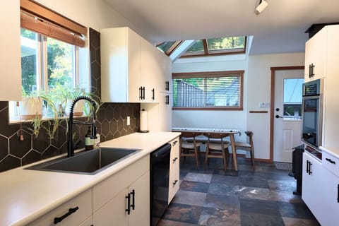 Galley kitchen stocked with essentials