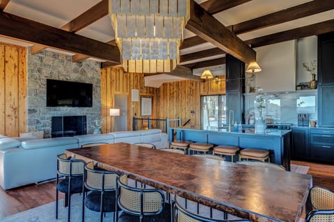 Dining area seats 20. 10 at the dining table and 10 at adjacent bar areas.