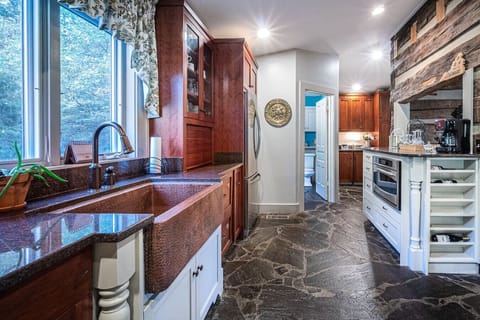 Bright, Well-Lit Kitchen with a Wide Window Offering Beautiful Views – Stocked with All Cooking Essentials