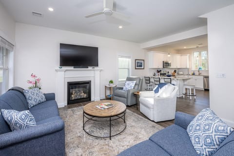 Cozy living room with propane fireplace, perfect place to unwind.