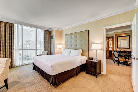 Spacious bedroom with amazing floor to ceiling city views.