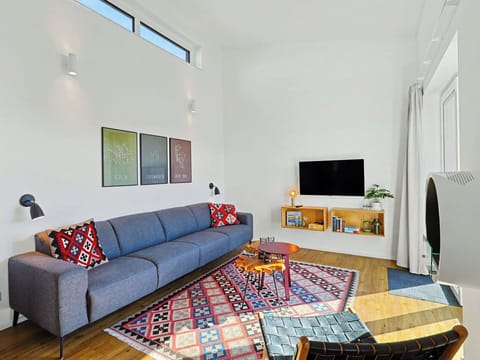 Furniture, Interior Design, Couch, Flooring, Wall, Living Room, Floor, Wood, Room, Home