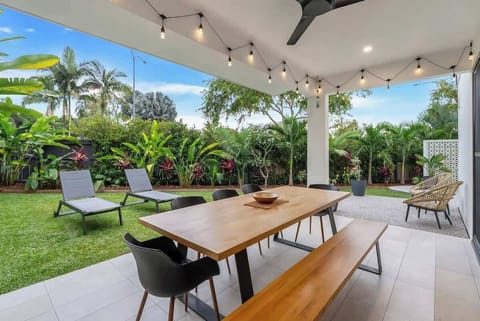 The outdoor dining area connects directly to the kitchen, allowing effortless entertaining and long dinners under the soft glow of festoon lights.