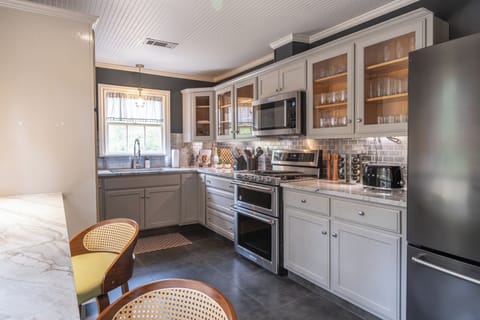 Cook, gather, and connect. A fully stocked modern kitchen ready for family feasts and game-day spreads.
