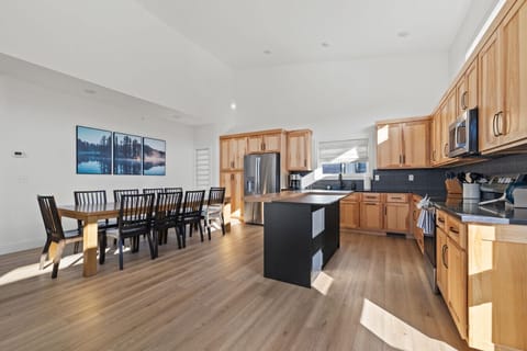 Cook your favorite holiday dishes in the spacious kitchen, then serve them at the long table designed for extended family dinners.