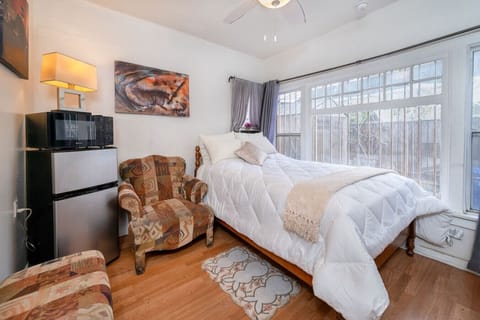 Private studio in a two-story apartment building with 15 units, offering a private entrance, dual security doors (wood + metal screen), 24/7 self check-in via lockbox, full-size bed), private bathroom, work desk, Smart TV, fast Wi-Fi, refrigerator, microw