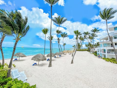 Beach nearby, white sand, sun loungers, beach umbrellas