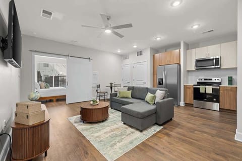 - Bright open living room with cozy sofa, modern decor, and downtown views
- Stylish layout designed for relaxing, working, and enjoying your city stay
- Modern apartment seating that brings comfort, convenience, and easy travel vibes
