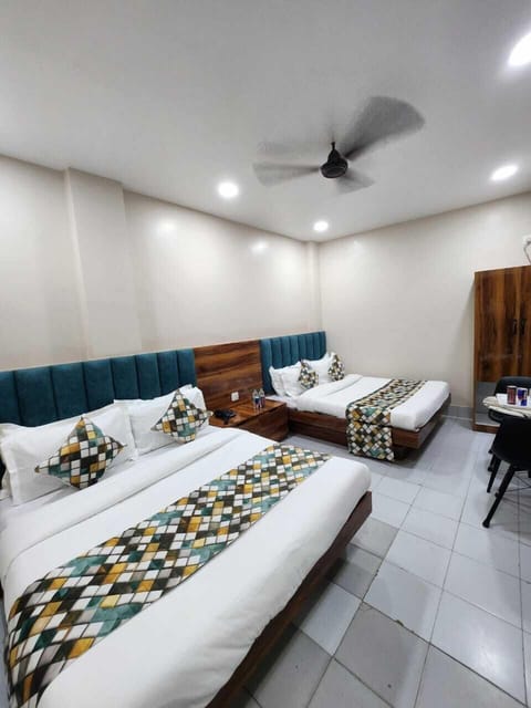 Luxury Triple Room, City View | Desk, laptop workspace