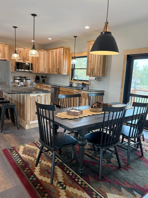 Open floor plan kitchen and dining area, extra seating at the island.