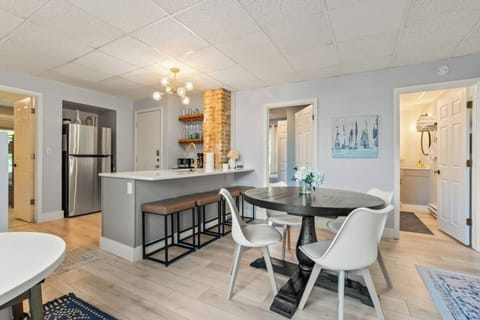 Gather around in this inviting kitchen and dining area, perfect for cooking, sharing meals, and making memories together.