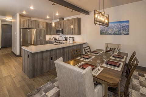 Dining table with seating for 6, two additional chairs for larger parties. | Main Level