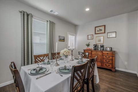 Bright dining room with coffee bar and seating.