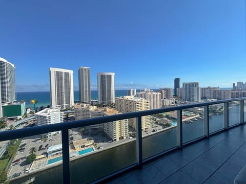 Private balcony with outdoor seating and skyline views.