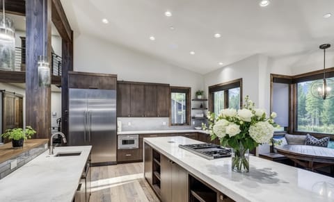 The Chef's Kitchen — where modern luxury meets rustic warmth. Dual dishwashers, beverage station, oversized fridge (plus a 2nd in the garage), and built-in charging ports throughout. 🍷👨‍🍳