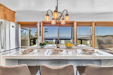 Dining area: Kitchen island with 6 barstools, open to living room